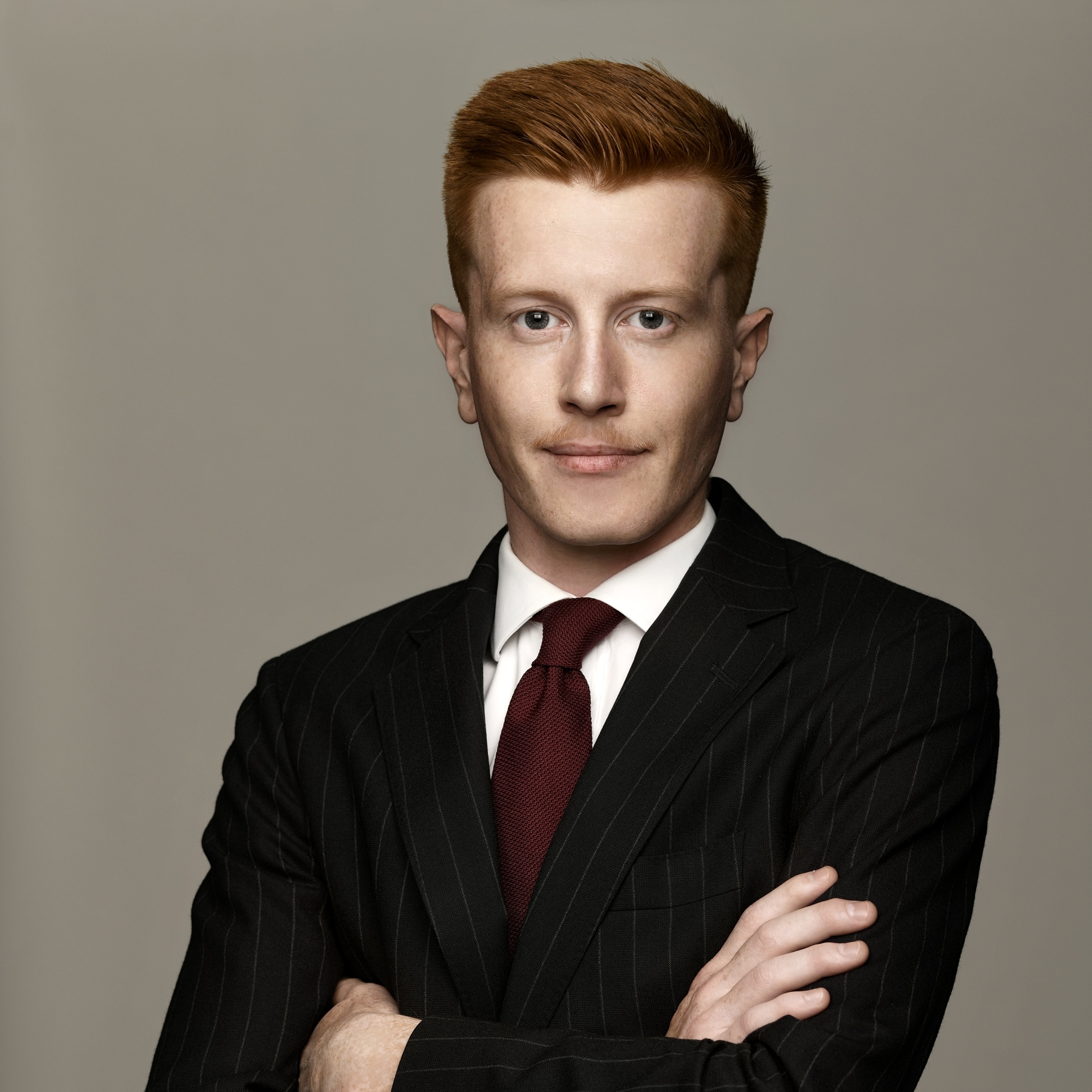Antoine in a suit, finance side